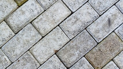Rough gray brick pavement texture