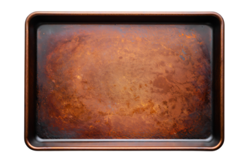 Top down view of a heavily textured, rustic metallic baking sheet with a rich, worn copper patina.