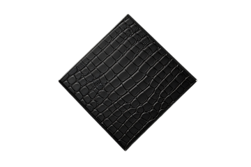 Luxurious black alligator skin textured panel or leather swatch with a high-gloss finish, isolated on a dark background.