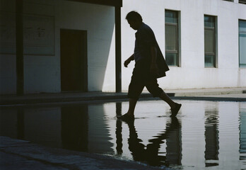 silhouette of a woman walking on the street