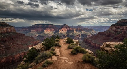 Scenic panorama of the Grand Canyon with dramatic storm clouds in the sky creating an
