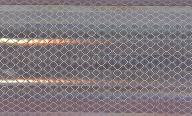 Diamond-patterned mesh close-up abstract textured background