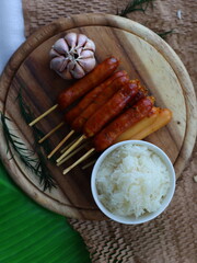 Grilled sausage — a popular street food in Thailand and many cultures worldwide. Juicy and smoky, these sausages are cooked over charcoal or an open flame until golden brown. 