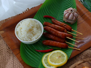 Grilled sausage — a popular street food in Thailand and many cultures worldwide. Juicy and smoky, these sausages are cooked over charcoal or an open flame until golden brown. 