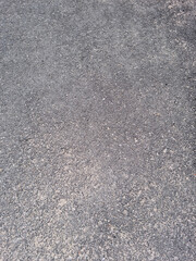 This is a close-up of an asphalt road.