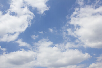 Blue sky with puffy clouds