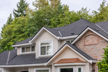 op of luxury house with shingle roof and nice windows in Summer in Vancouver, Canada, North America. Day time on August 2025.