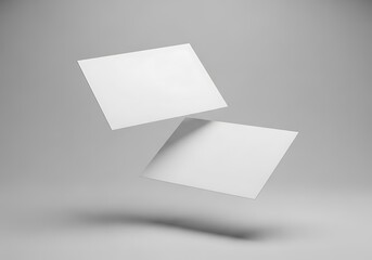 Two blank white square cards floating in the air