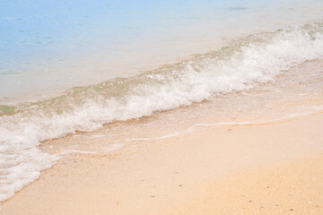Beach sand background for summer vacation concept. Beach nature and summer seawater with sunlight light sandy beach Sparkling sea water	