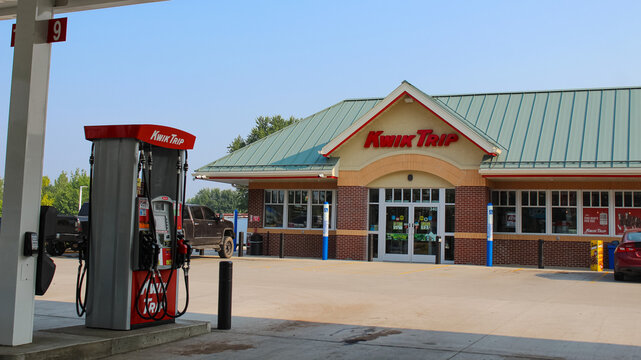 Cadott, WI (USA) - August 2, 2025: The front of a Kwik Trip with a fuel pump in the foreground. The chain has a strong presence in the Midwest and is known for high-quality food. Editorial Use Only.