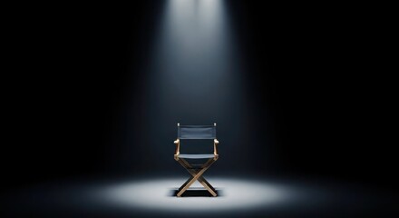 Director's chair centered in a spotlight against a black background, creating a dramatic and isolated scene.