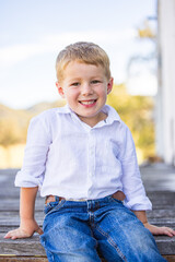 Portrait of happy little boy smiling on farm