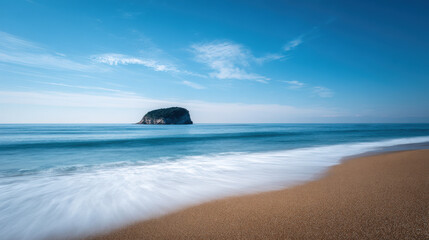 tranquil summer landscape highlighting solitary rock on horizon with serene coastline