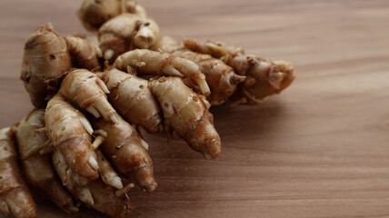 Aromatic ginger on wooden surface