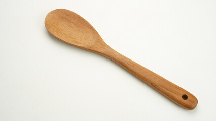 Wooden spoon isolated on white background. Copy space.