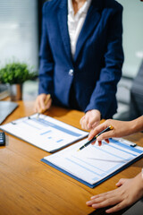 Business people meeting at office writing notes about sticky notes Laptop,tablet Planning and Brainstorming Strategies of Colleagues in office
