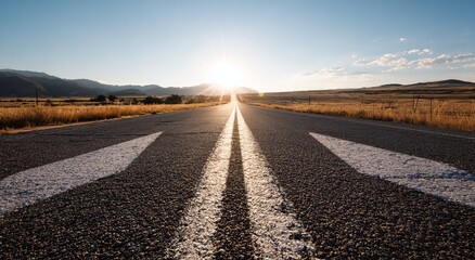 Naklejka premium Empty highway stretching into a vibrant sunset