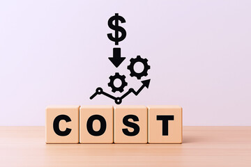 Wooden Blocks Spelling 'COST' with Downward Dollar Arrow and Interlocking Gears Featuring Upward Graph – Conceptual Image of Cost Management and Efficiency Improvement