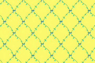 Fototapeta premium Seamless yellow floral pattern with green vines and blue bows, a decorative and ornate design with a repeating lattice structure