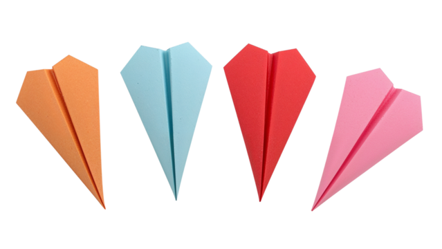 Colorful paper airplanes ready for flight inspiring creativity and dreams with orange, blue, red and pink designs symbolizing ambition