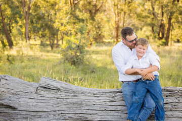 Father and son portrait in rural Australian bush setting