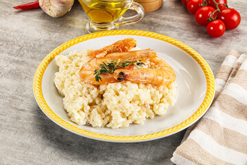 Italian risotto with prawn served thyme