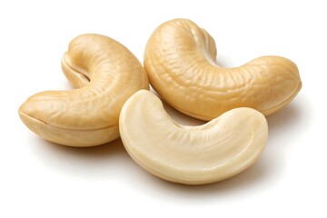 Three Creamy Cashew Nuts with a Single Nut Split in Half on a White Background raw cashews