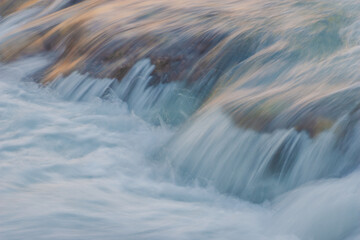 water flowing over rocks  waterfall