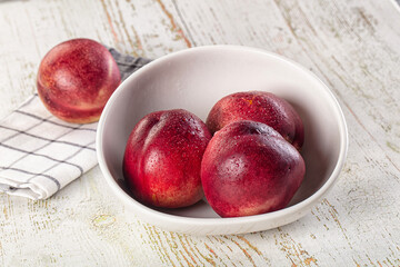Ripe sweet juicy nectarines heap