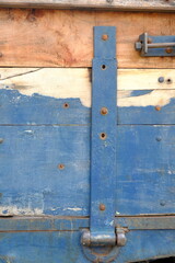 weathered blue and white wooden board
