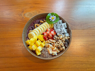 Acai bowl is a Brazilian-inspired dish made from pureed, frozen acai palm fruit, typically served in a bowl as a smoothie and topped with various ingredients. 