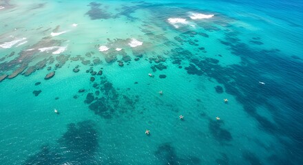 High angle view of turquoise ocean with boats