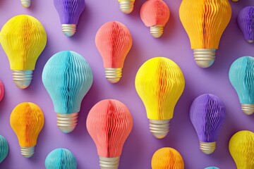 Colorful paper cutout light bulbs create a vibrant display on a purple background, celebrating creativity and playfulness in design