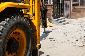 roadwork in progress with digger at construction site