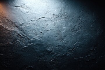 Textured dark gray wall, lit from above with contrasting light