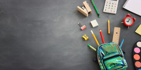 Back to school concept over classroom blackboard. Top view