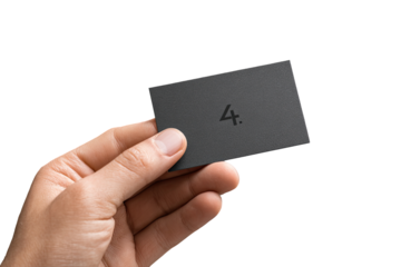 Hand holding a dark gray business card