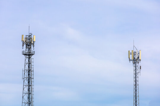 telecommunication  towers stand against a sky, modern wireless communication. for broadcasting 6G, 5G, and signals for telecommunications infrastructure, and the expansion of digital connectivity. - Powered by Adobe