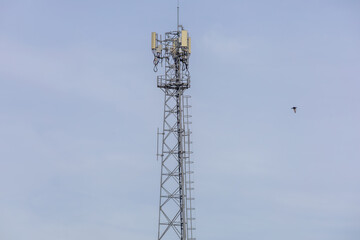 telecommunication  towers stand against a sky, modern wireless communication. for broadcasting 6G, 5G, and signals for telecommunications infrastructure, and the expansion of digital connectivity.
