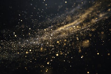 Naklejka premium Gold dust particles swirl and shimmer in the air, creating a captivating visual effect against a dark background during a mesmerizing display of light