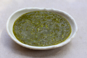 Thai green seafood dipping sauce in a small ceramic bowl
