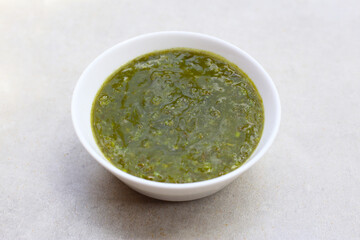 Thai green seafood dipping sauce in a small ceramic bowl