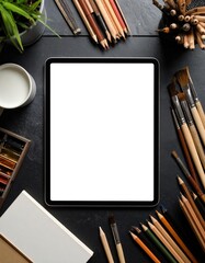 An organized creative workspace with art supplies, a blank tablet, and inspiring tools for artistic expression.