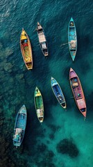 A fleet of color drifting on teal canvas