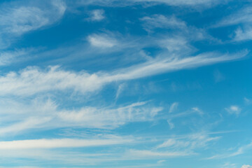 Thin clouds crossing a deep blue sky