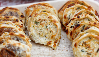 A tray of food with a variety of different shaped pastries