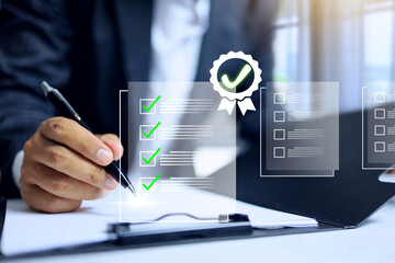 Document approval concept with businessman on working desktop to tick check mark on a paper...