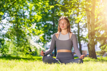 Yoga practice in a serene outdoor setting during bright daylight
