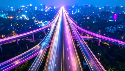Futuristic aerial view of a city highway at night with vibrant long exposure light trails symbolizing urban speed and data flow.