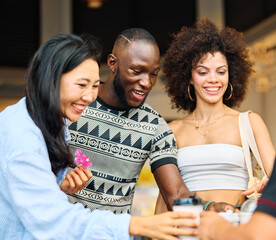 Portrait of group of young people drinking coffee in coffee shop city street, walking together and having fun.